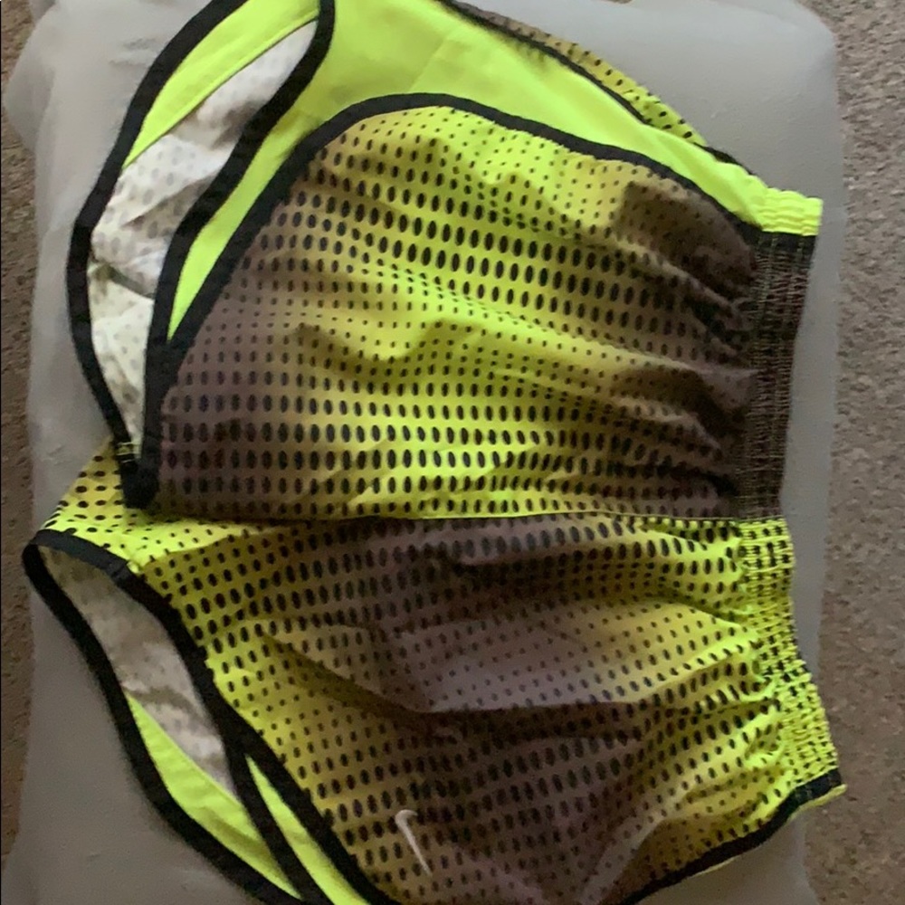 NIKE green dotted shorts.